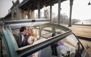 A kiss in the old french car at Bir Hakeim bridge