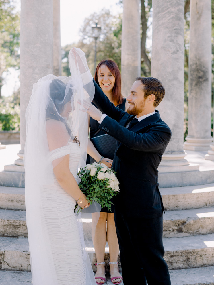 the groom remove the veil as a traditional wedding