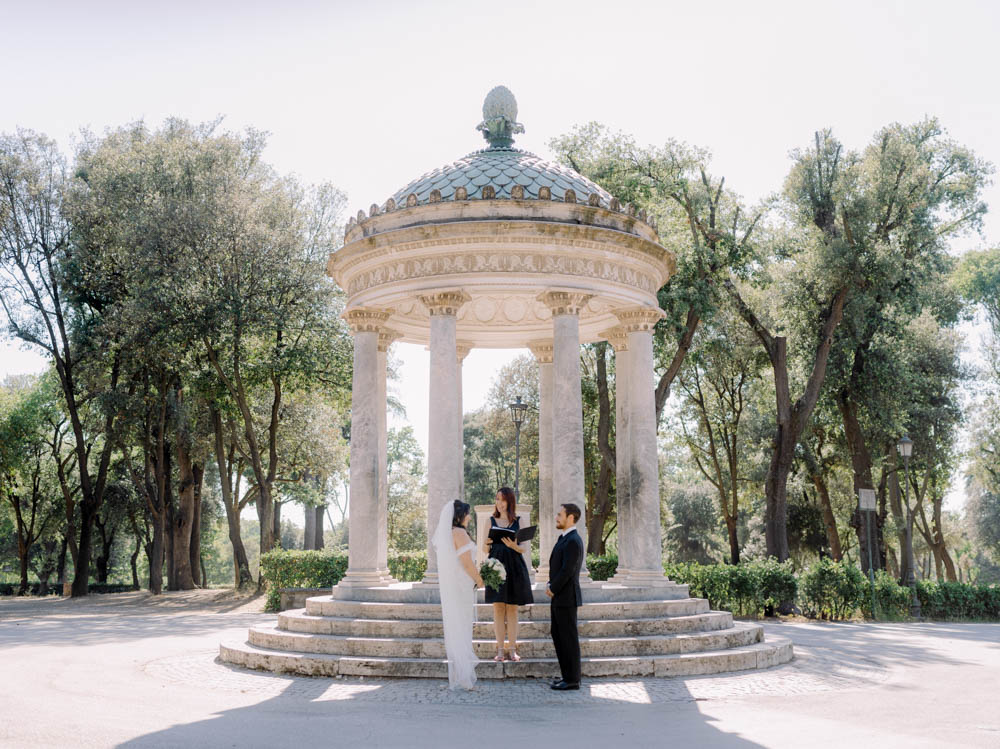 The temple in the Borghese gardens with the couple and the celebrant ready for the ceremony