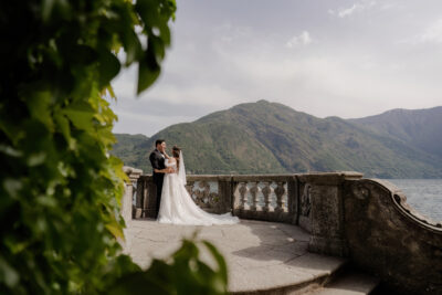 The balcony over the lake with a couple of bride and groom