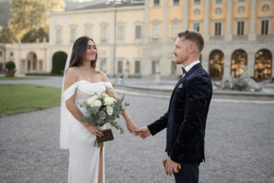 a couple in front of the Villa Olmo Building