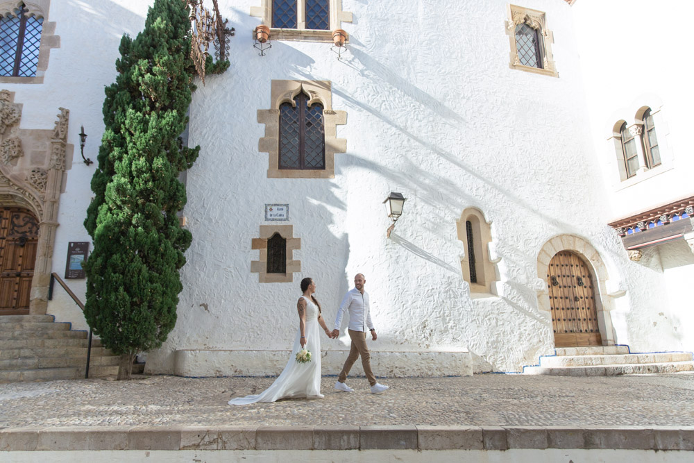 Taking a walk after the ceremony the couple walks hand to hand