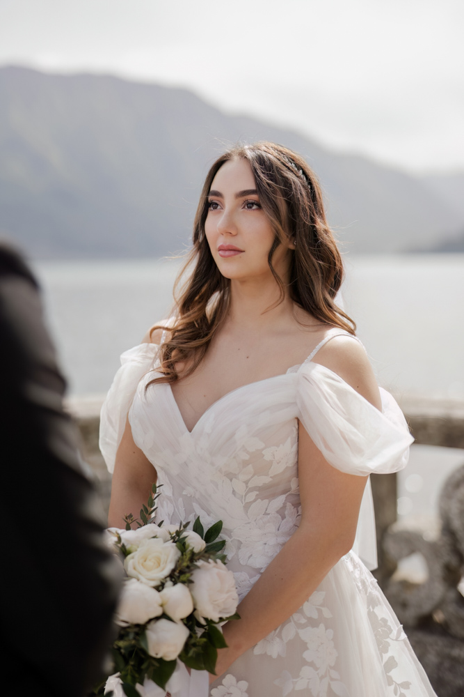 the bride looks to the groom and smiles during the speech of the celebrant