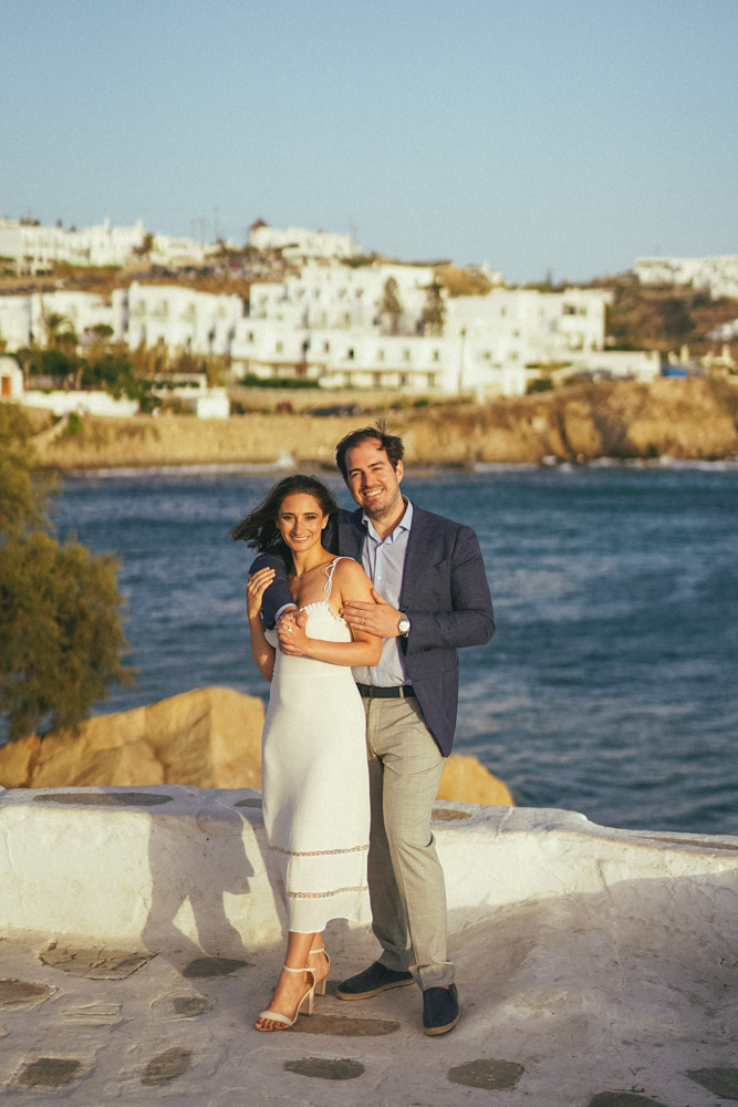 The bride and groom posing by the see in Mykonos