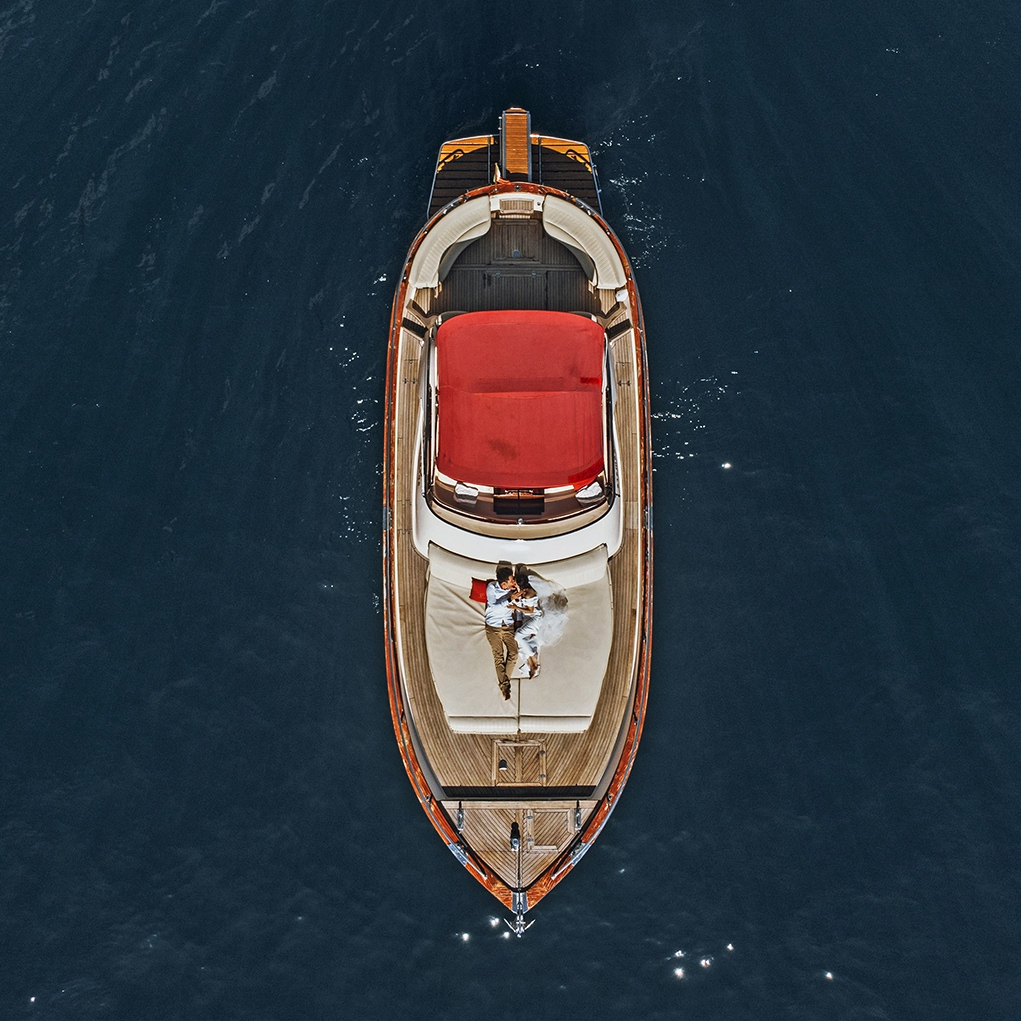 A couple on a boat enjoying the moment after the ceremony