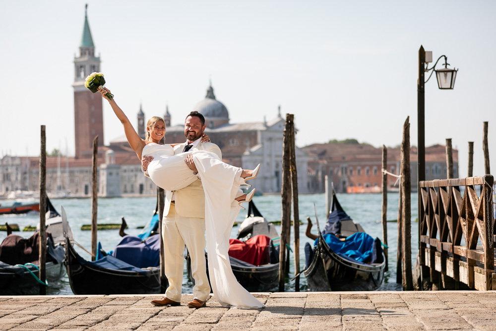 San Maggio as a backdrop for the groom with the bride on his arm