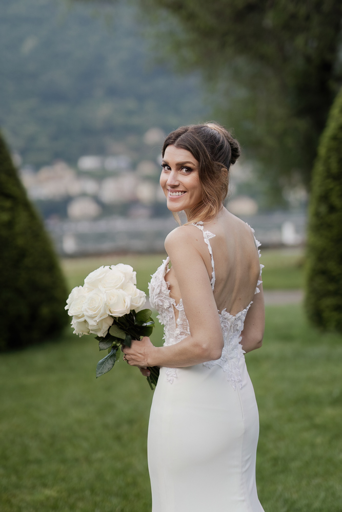 A nice pose of the bride looking back in the garden