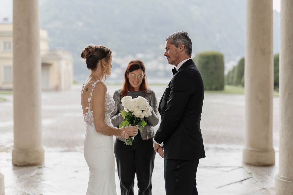 The couple stands facing each other