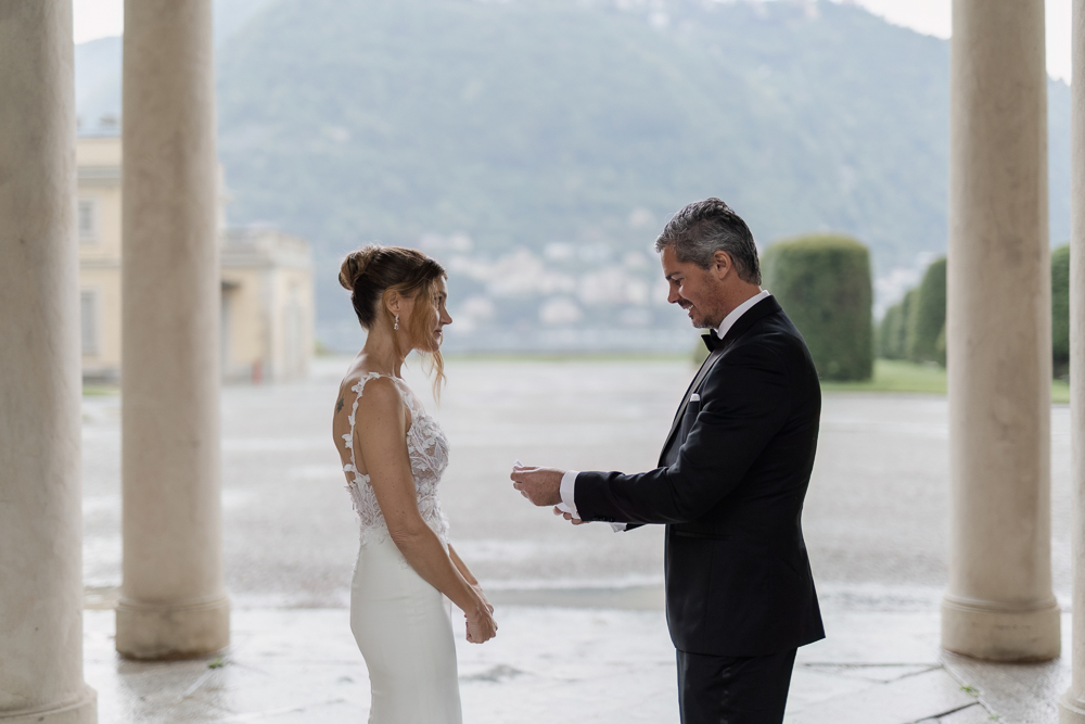 The groom reads his vows with a paper note