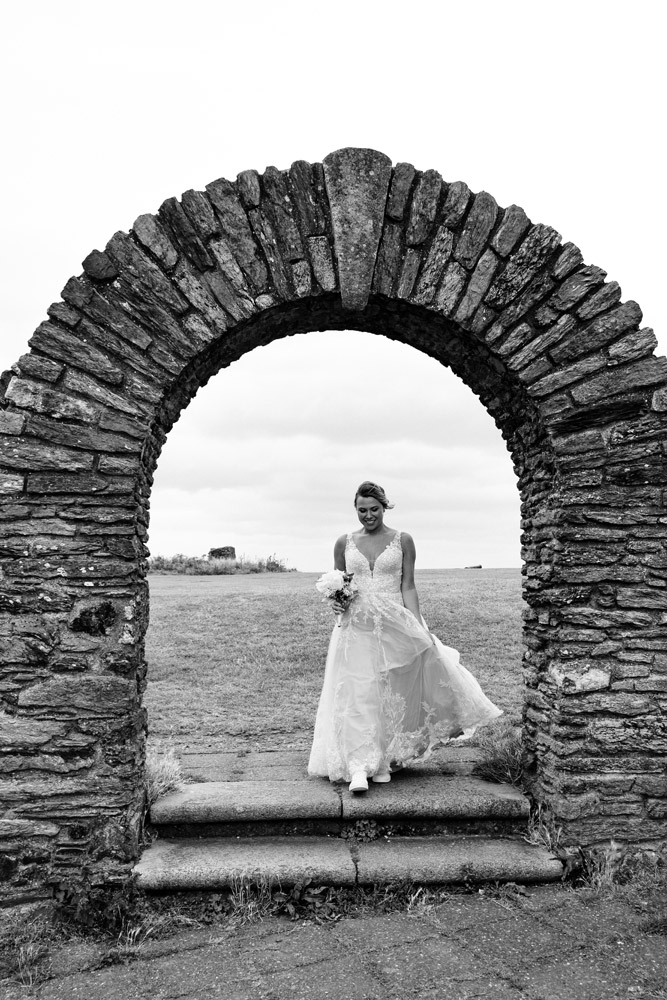 The bride arrives to the first look point, focused on her way.