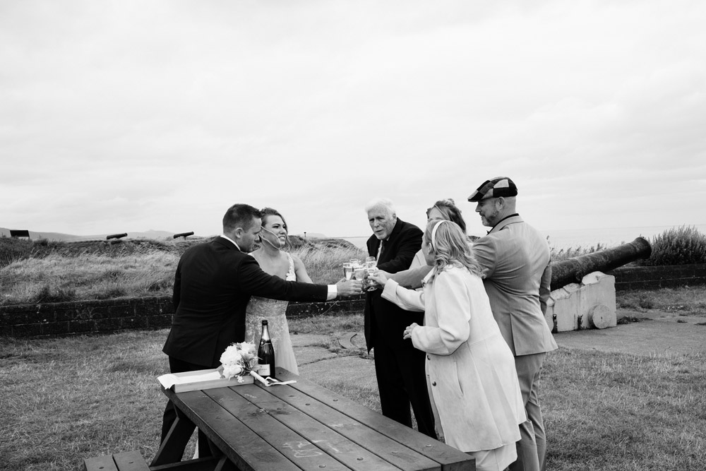 The family celebrates the wedding with a glass of champagne