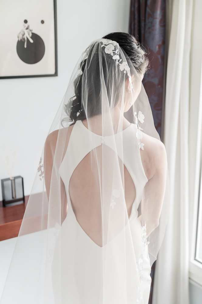 a great view of the back of the dress of the bride