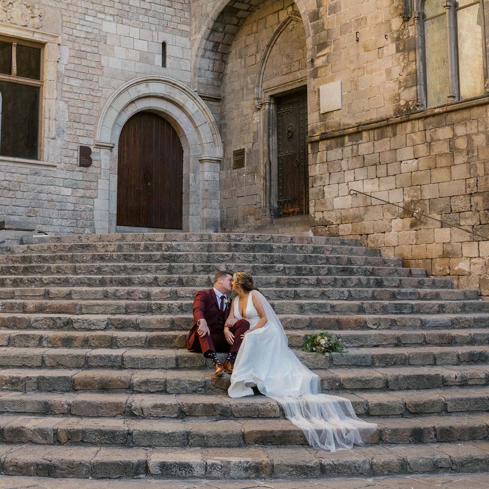 A kiss on a staircase of old church in Gothic district of Barcelona