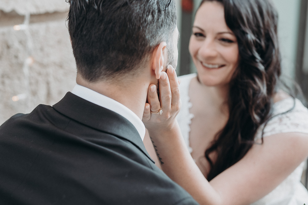 The bride does a gentle caress on the cheek