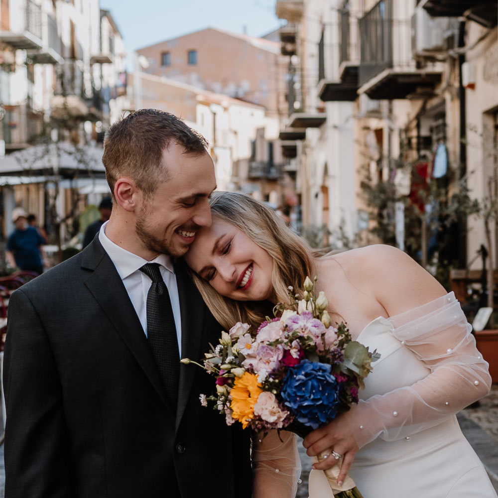 the couple takes a walk in the old street of the village of Palermo after their elopement