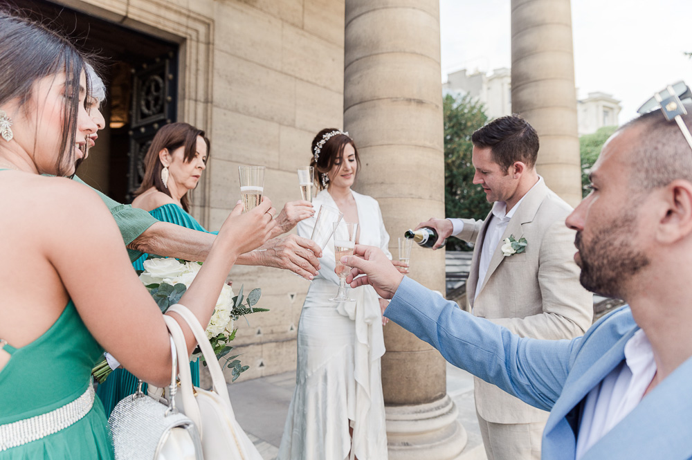 A glass of champgane for family and friends on the stairs of Chapelle expiatoire in Paris