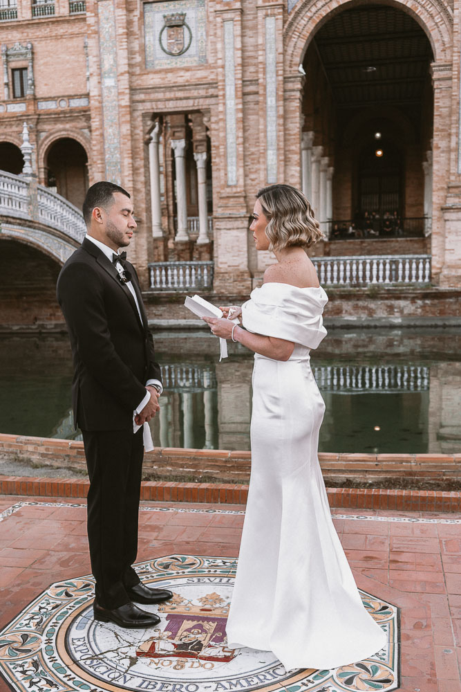 The bride and groom exchange their vows in Paza Espana in Seville